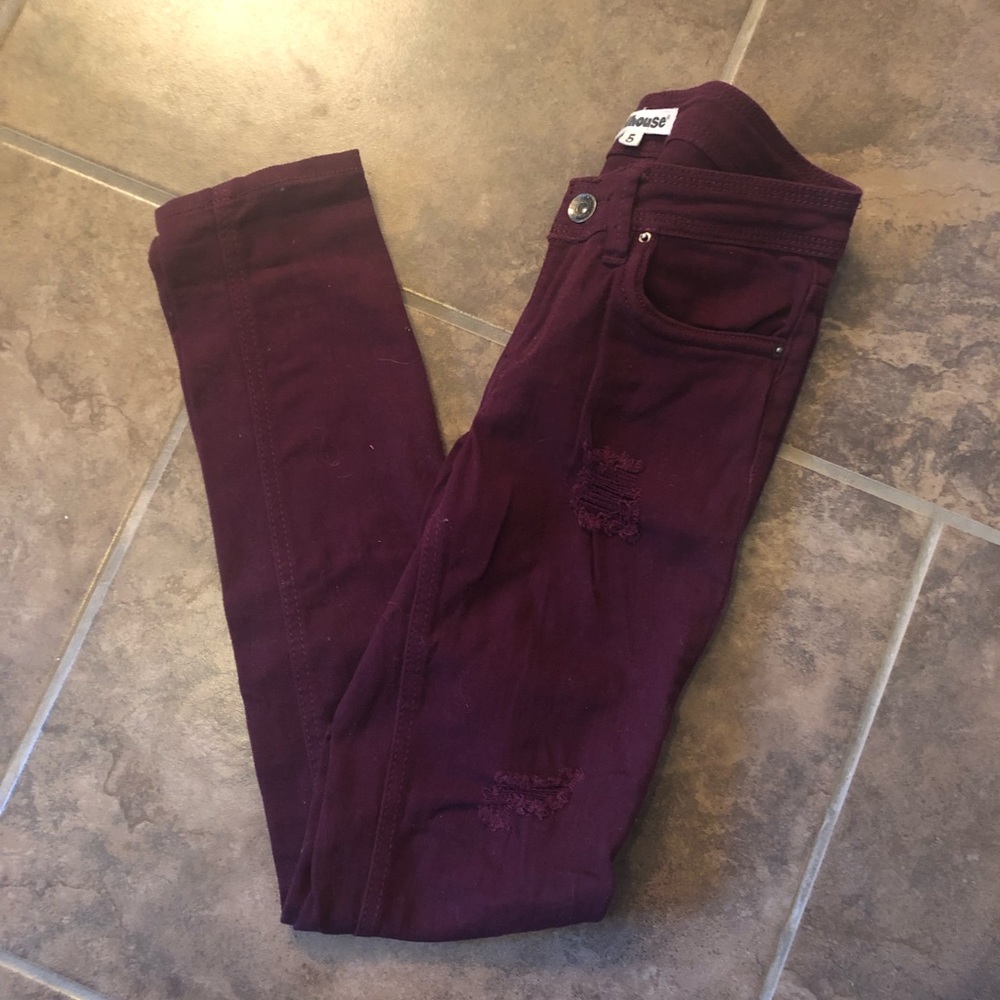 Burgundy distressed skinny jean